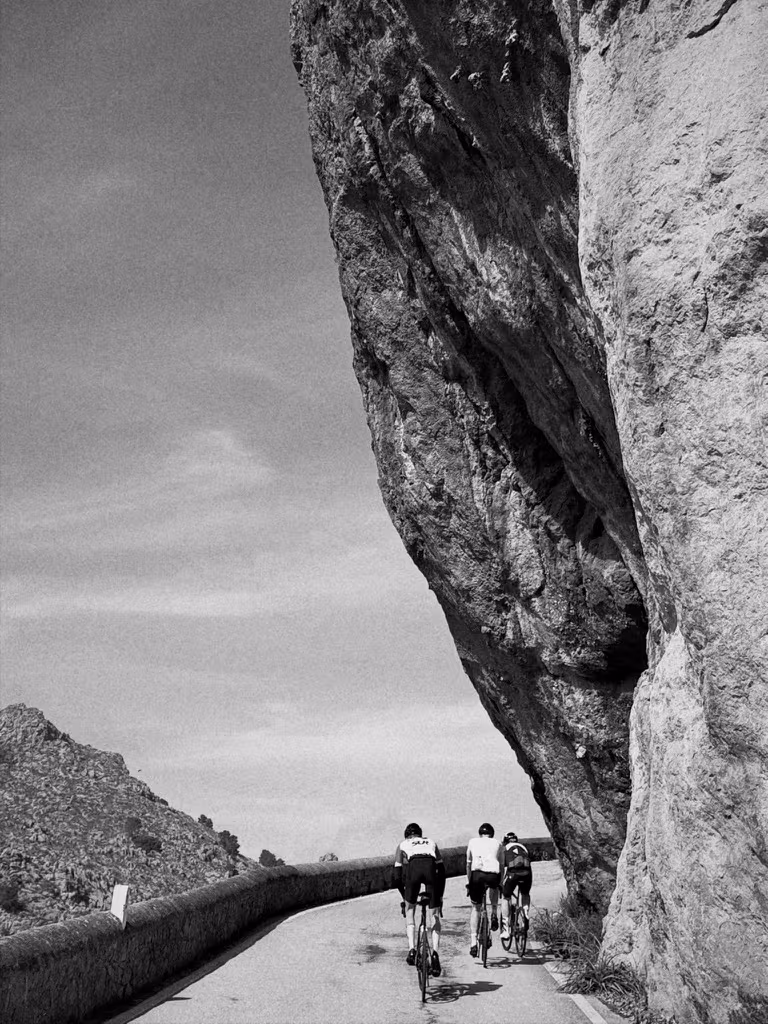 Cyclists riding through Sa Calobra in Mallorca