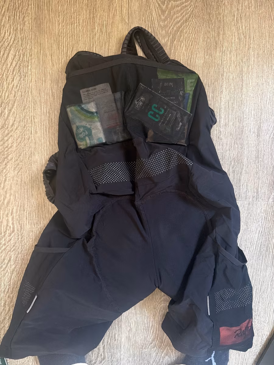 Cycling bib shorts with food packets tucked into their pockets.
