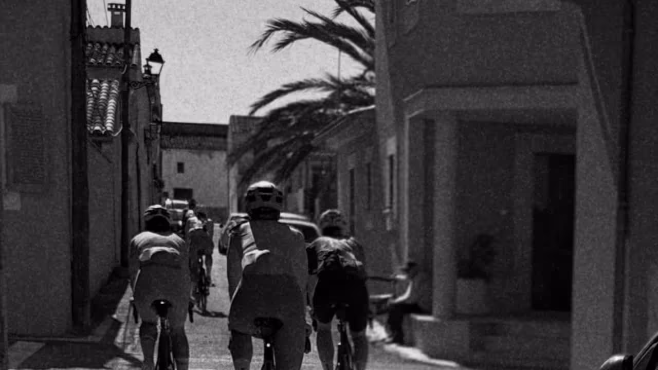 Cyclists rolling through a Mallorcan village