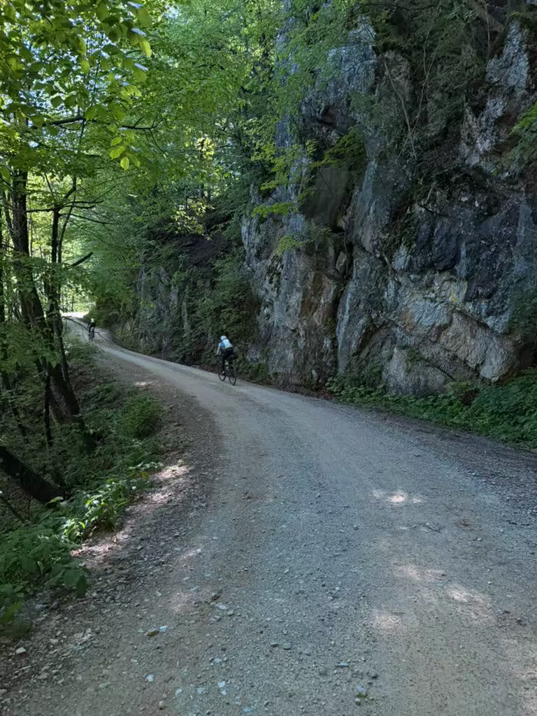 Rider on smooth gravel through a Slovenian gorge